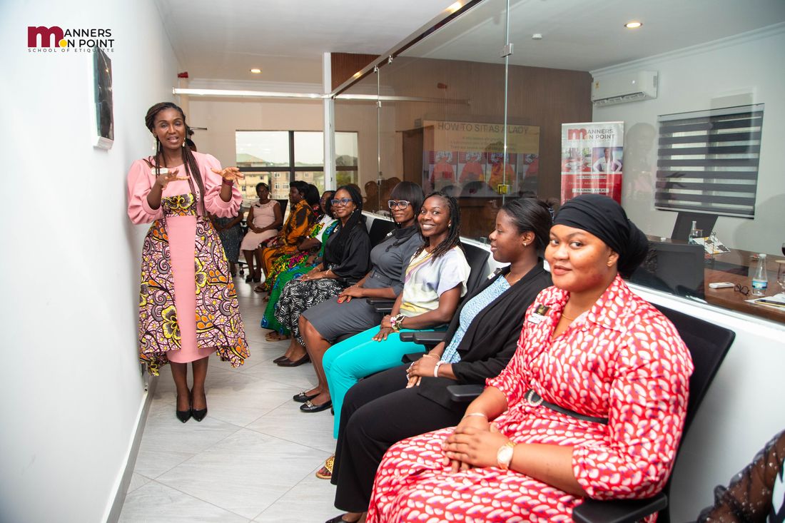 The trainer leading a practical session for a room of seated participants.