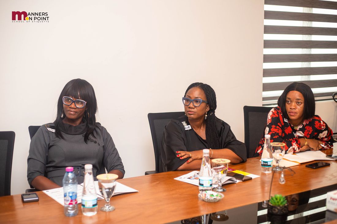 Participants seated at the boardroom table during a discussion.